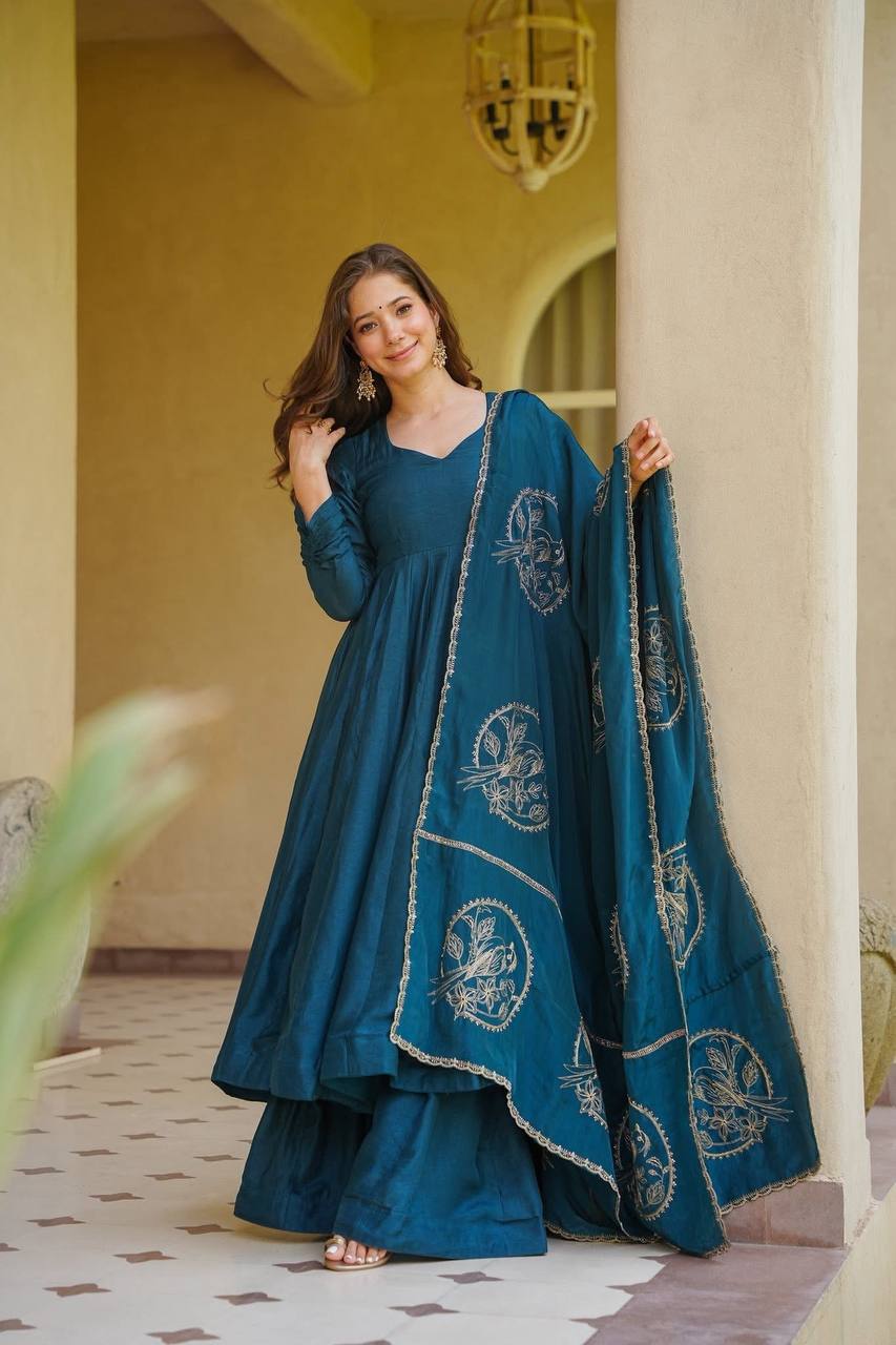 Elevate Your Ethnic Wardrobe With This Elegant Heavy Vichitra Silk Anarkali Suit Set, Designed For Women Who Love Timeless Grace And Luxurious Comfort. Crafted From Premium Vichitra Silk, This Beautifully Tailored Ensemble Includes A Flowing Anarkali, A Matching Palazzo, And An Exquisitely Embroidered Dupatta, Making It A Perfect Choice For Weddings, Festive Celebrations, And Special Occasions. 💃✨