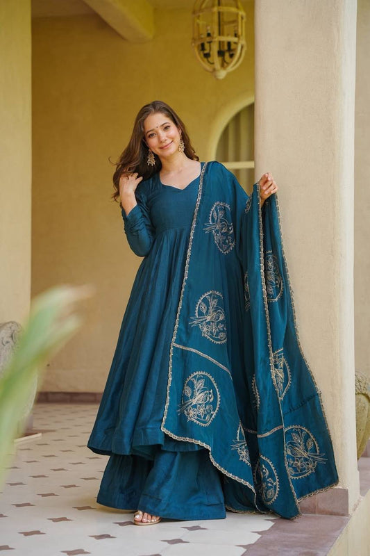 Elevate Your Ethnic Wardrobe With This Elegant Heavy Vichitra Silk Anarkali Suit Set, Designed For Women Who Love Timeless Grace And Luxurious Comfort. Crafted From Premium Vichitra Silk, This Beautifully Tailored Ensemble Includes A Flowing Anarkali, A Matching Palazzo, And An Exquisitely Embroidered Dupatta, Making It A Perfect Choice For Weddings, Festive Celebrations, And Special Occasions. 💃✨