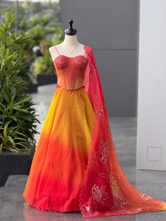 Haldi Function Wear Yellow And Orange Color Lehenga With Trendy Corset Pattern Blouse And Designer Batwa