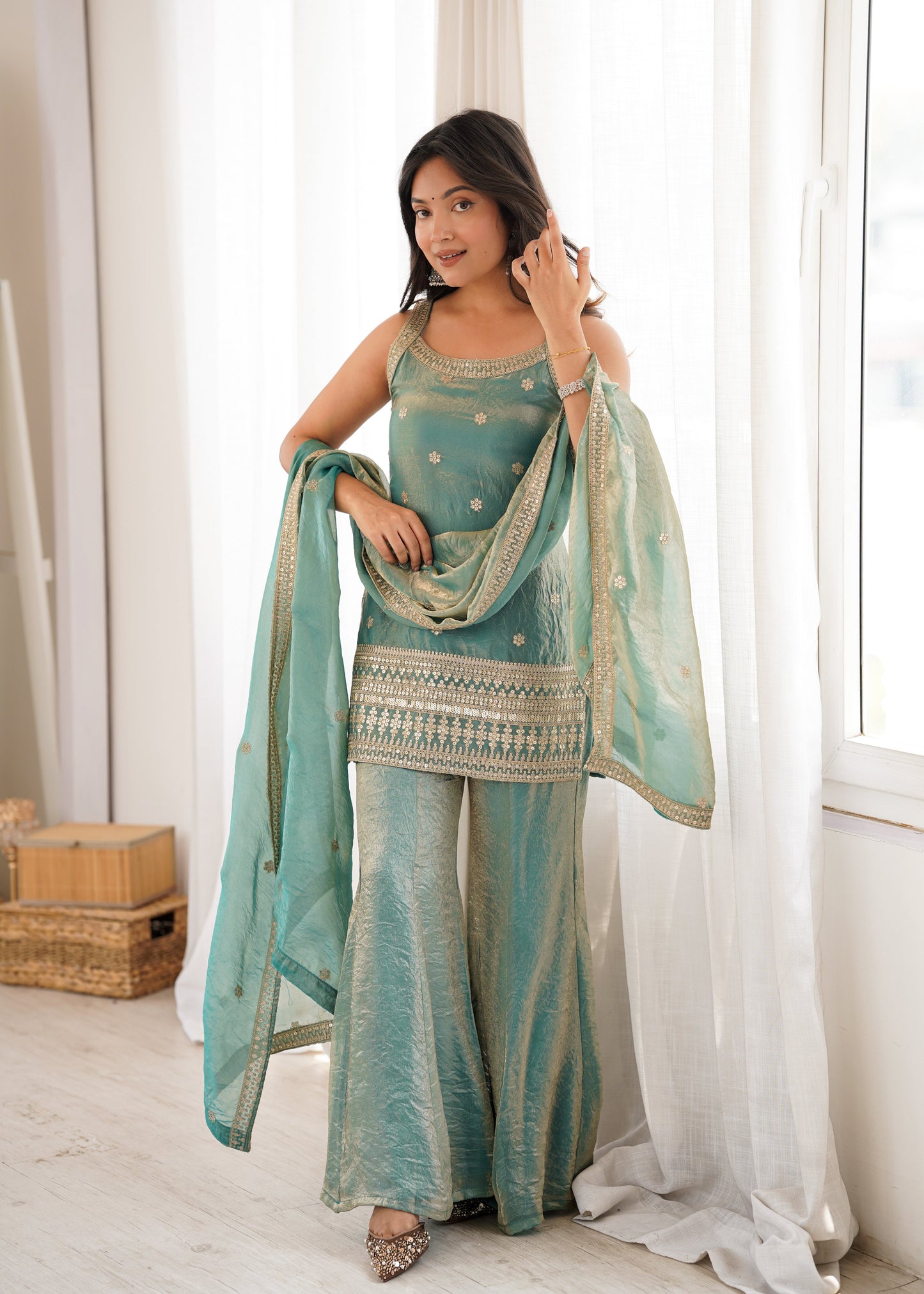 Woman in a stylish suit smiles for a portrait | Sharara Set For Women