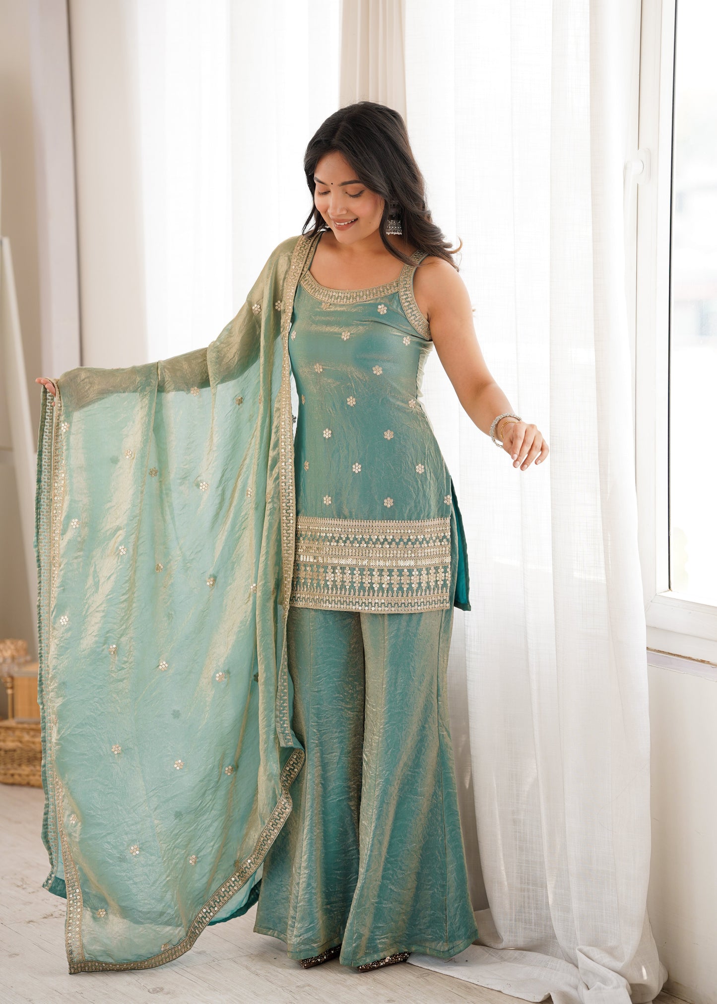 Woman in a stylish suit smiles for a portrait | Sharara Set For Women