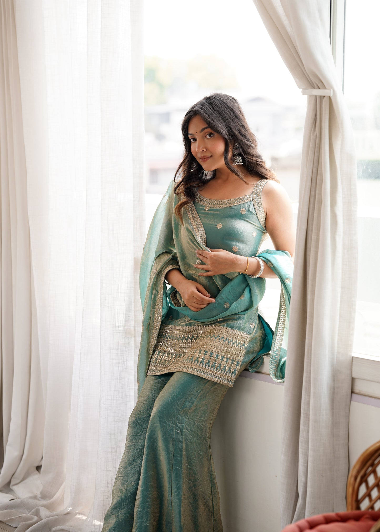 Woman in a stylish suit smiles for a portrait | Sharara Set For Women